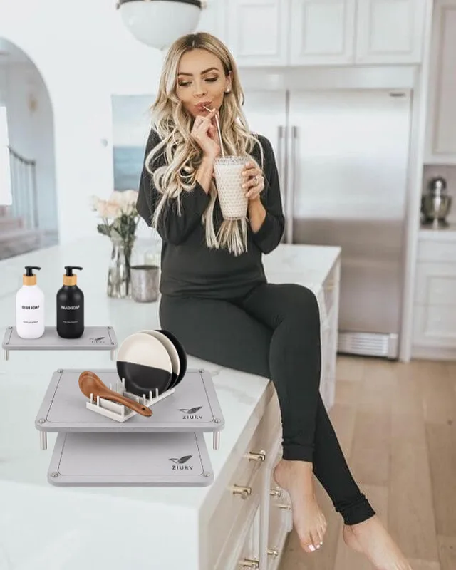 Compact plastic dish rack positioned on top of stone mat