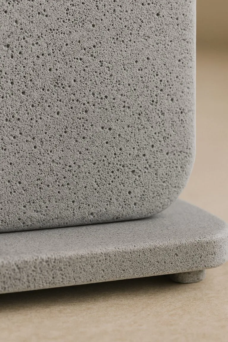 Close-up of diatomaceous stone surface showing porous texture and elevated base on kitchen counter