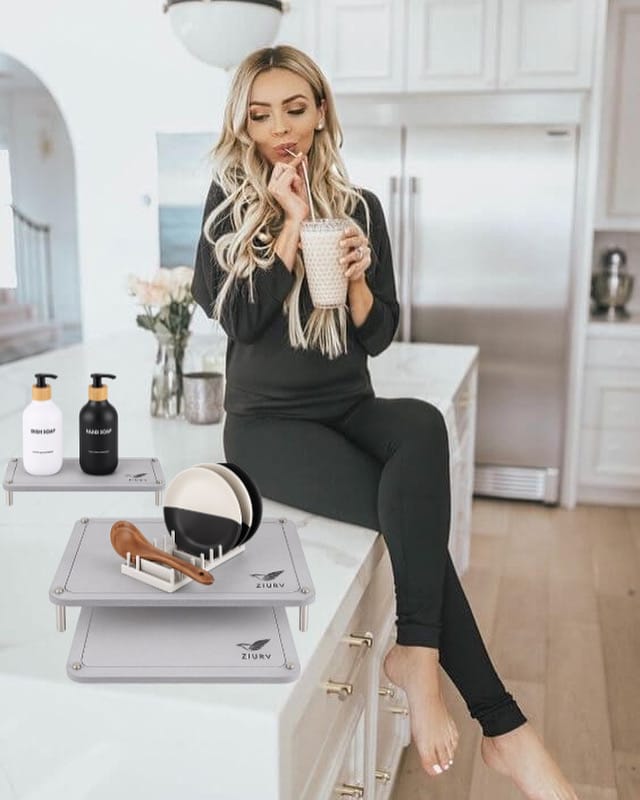 Compact plastic dish rack positioned on top of stone mat